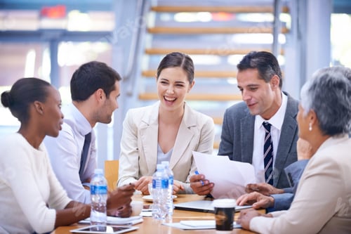 Preview: A group of businesspeople having a lively meeting together