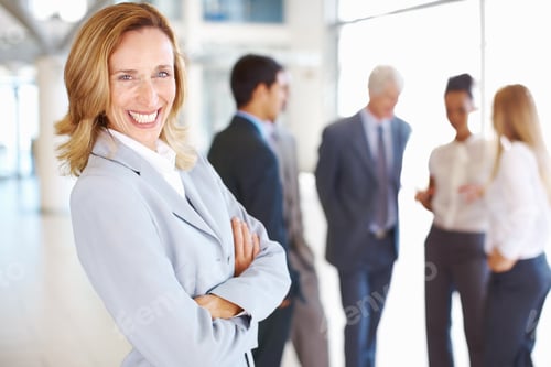 Preview: Happy business woman with associates discussing