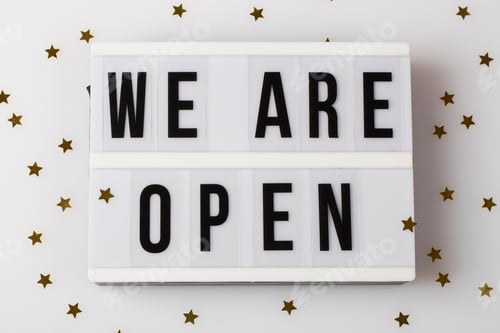 Preview: Light box with text we are open on white background with small stars