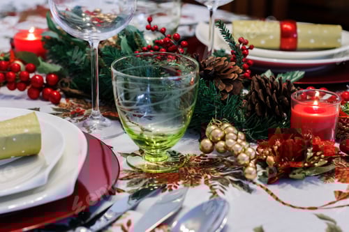 Preview: Christmas table decorated in red with a candlelight. Tablescape, festive table setting