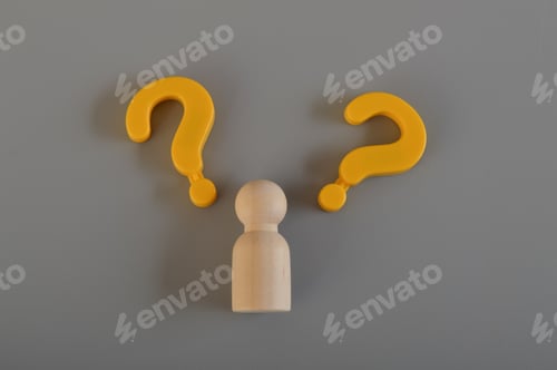 Preview: Wooden figure and question mark symbols.