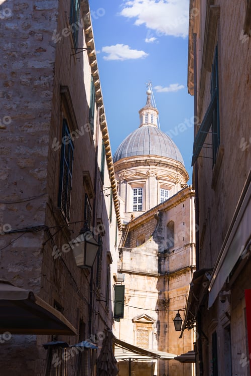 Preview: Dubrovnik cathedral dome rising above narrow old town street