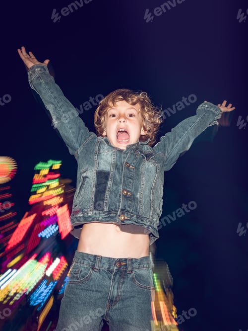 Preview: Boy jumping on funfair