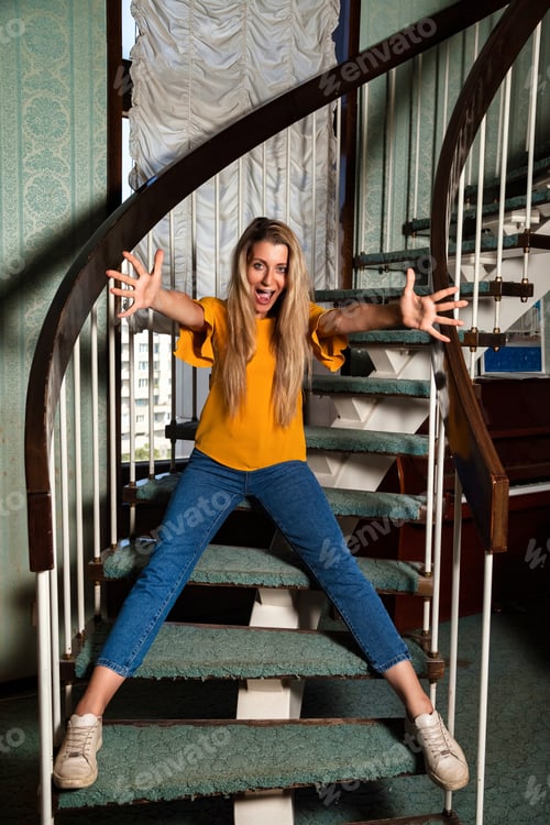 Preview: Vibrant Vintage Spirit Captured on a Grand Spiral Staircase Indoors