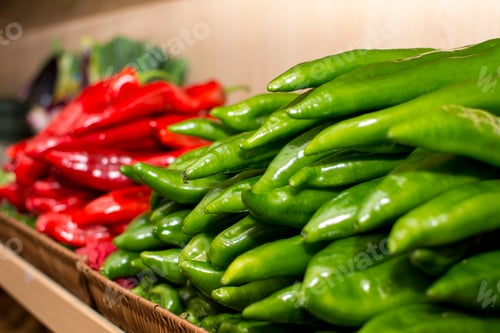 Preview: A shelf of vegetables in a store with a variety of vegetables.