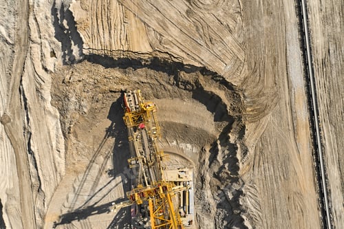 Preview: Aerial view of large heavy equipment machine mining natural resource. Coal mining by bucket wheel