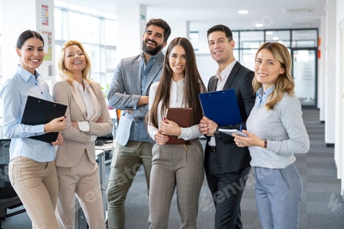 Preview: Group of diversity business young people in formal wear standing at office and looking at camera.