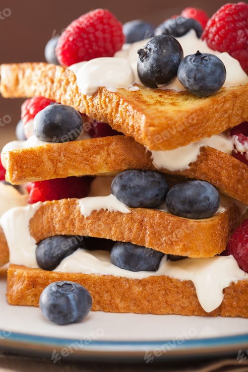 Preview: french toasts with creme fraiche and berries for breakfast