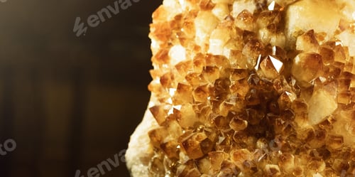 Preview: Citrine stone macro crystalls with small depth of field. Yellow quartz on dark background,banner