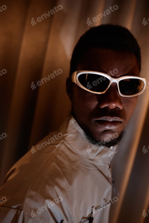 Preview: Close Up Young Black Man Wearing 90S Style Sunglasses and Looking at Camera