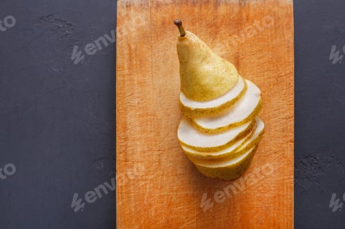 Preview: Healthy food, fruit background, sliced pear