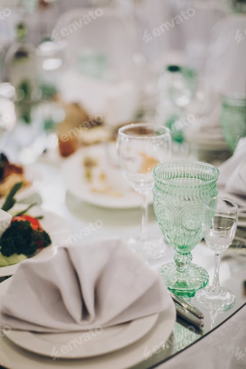Preview: Wedding luxury table setting at reception in restaurant