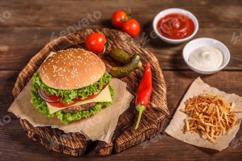 Preview: Delicious fresh juicy burger with beef cutlet, cheese, tomatoes and onions