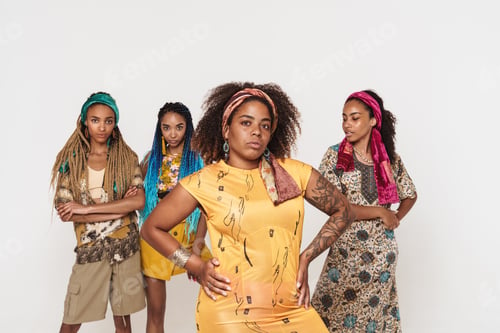 Preview: Young black four women wearing dress posing together on camera
