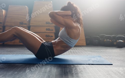 Preview: Fitness woman doing abs crunches