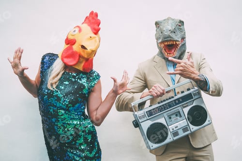 Preview: Crazy senior couple wearing chicken and t-rex mask while dancing outdoor