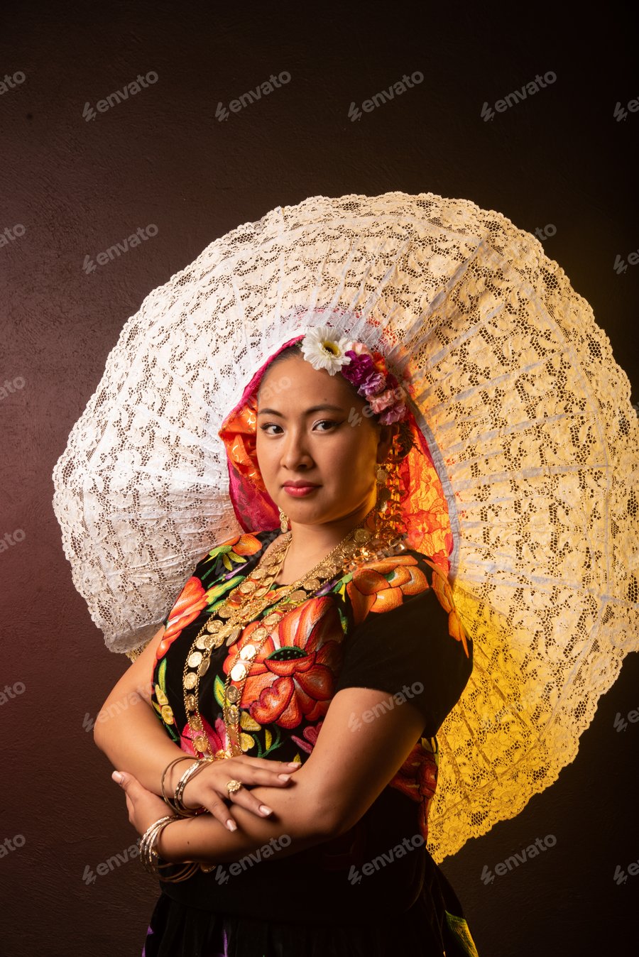 Cover for A woman wearing a flowery hat and a colorful dress poses for a photo