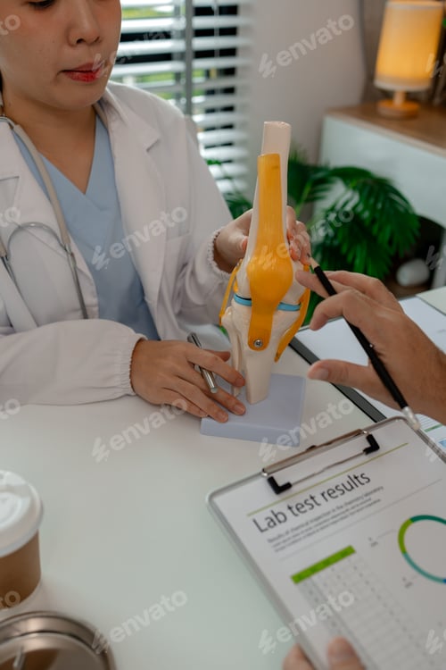 Preview: two surgeons are sitting in a private office at a hospital discussing an upcoming major knee ligamen