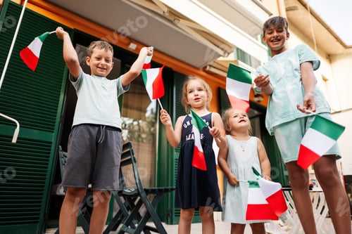Preview: Happy four kids with italian flags celebrating Republic Day of Italy.
