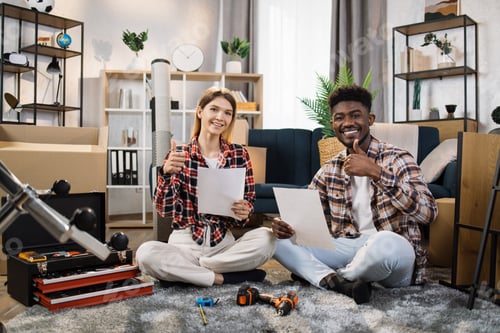 Preview: Happy couple reading furniture instruction at new house