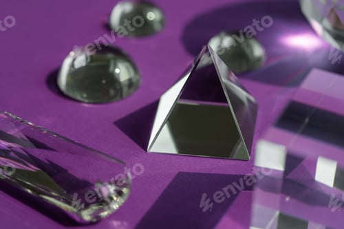 Preview: Crystal prism refracting light, magic crystals and pyramid, sphere and cube on purple background