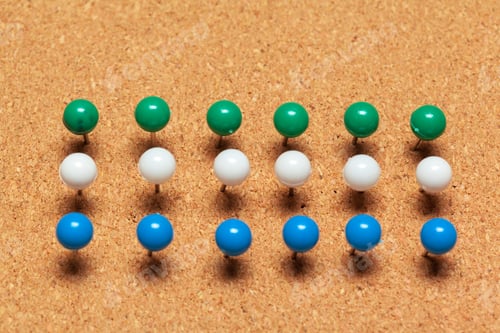 Preview: Group of thumbtacks pinned on corkboard in rows