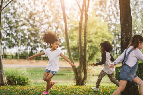 Preview: Cute african american little kid playing outdoor.