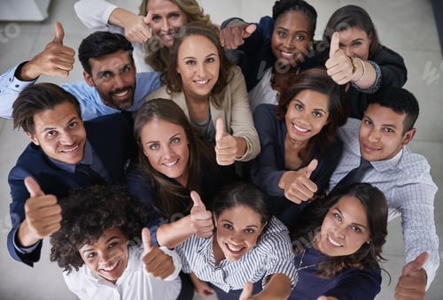 Preview: High angle portrait of a group of coworkers showing a thumbs up in the office