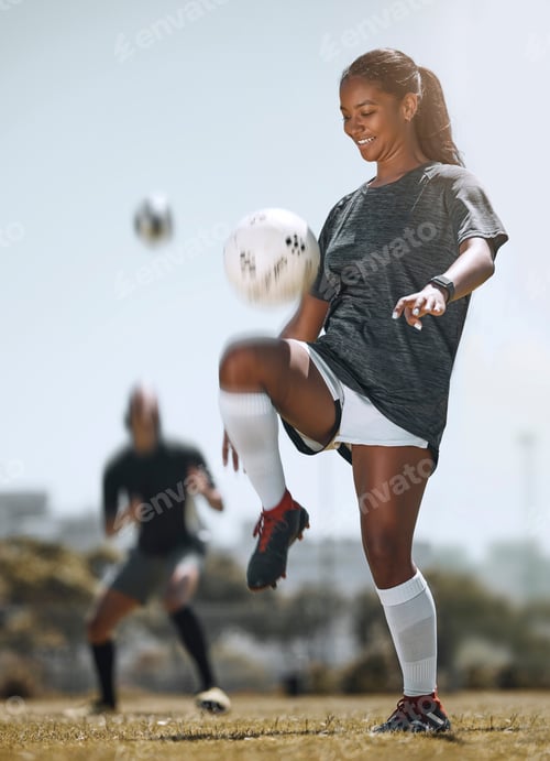 Preview: Football, sports and training with woman juggling with knees for workout, exercise and fitness on f