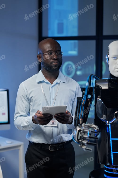 Man using tablet pc to control the robot