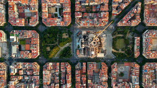 Preview: Aerial view of Barcelona city skyline and Sagrada Familia Cathedral. Eixample residential grid