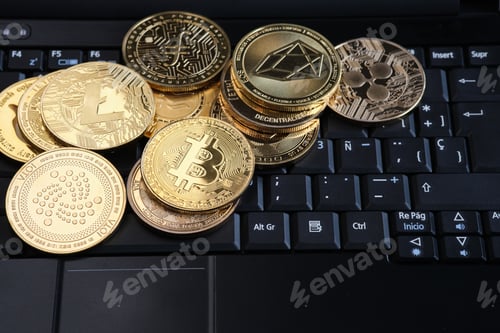 Preview: Various cryptocurrencies and laptop