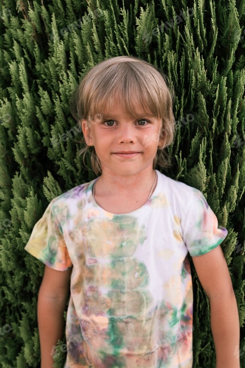 Preview: portrait face kid boy with freckles and problem allergic peeling skin long blond hair summer travel