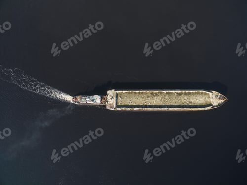 Preview: aerial view of tow pushing cargo by river