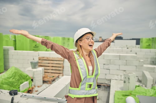 Preview: Female contractor admiring a new construction object