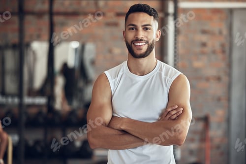 Preview: Portrait of a fit man arms crossed in the gym. Proud, muscular bodybuilder in the gym. Confident, s