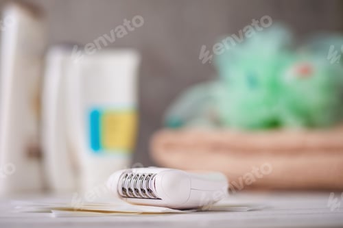Preview: Epilator and wax strips on background with towel