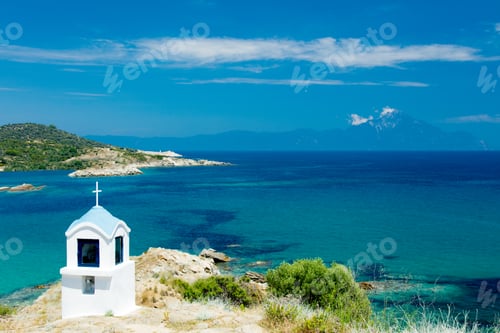 Preview: view on the wonderful small church in Greece on the sea background