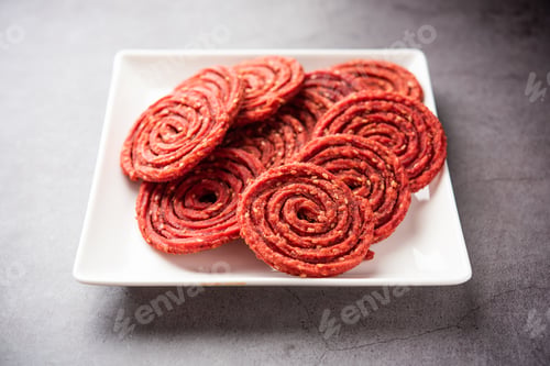 Preview: Beatroot chakli, murukku, Beetroot chakli, a spiral fried snack from India made in Diwali festival