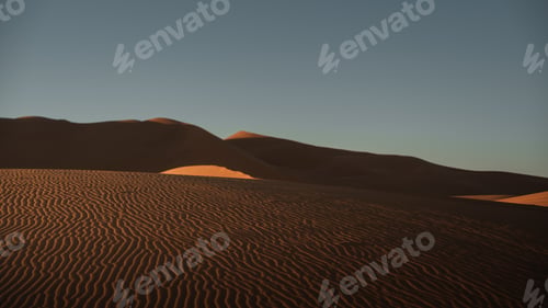 Preview: Windswept sand dunes creating a beautiful wavy pattern in sahara desert near merzouga in morocco