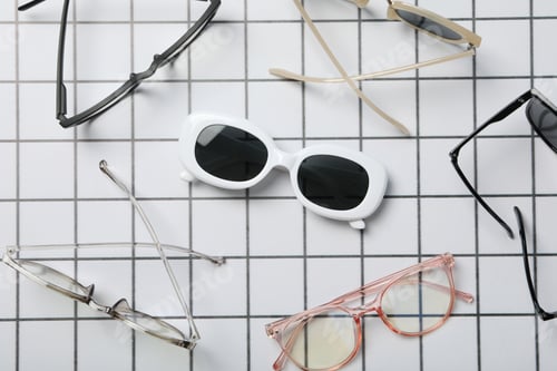 Preview: A pair of sunglasses on a checkered black and white background