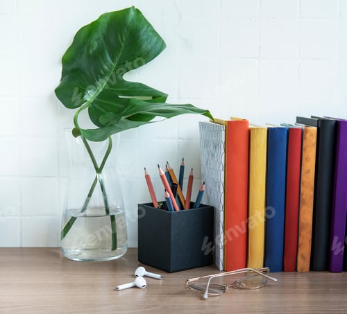 Preview: Stack of books on the desktop.