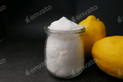 Preview: salt and lemon on black background