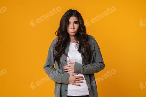 Preview: Unhappy beautiful girl posing and rubbing her belly