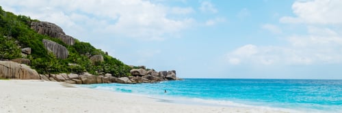 Preview: tropical beach with huge boulders and palm trees Coco Island Tropical Seychelles Islands
