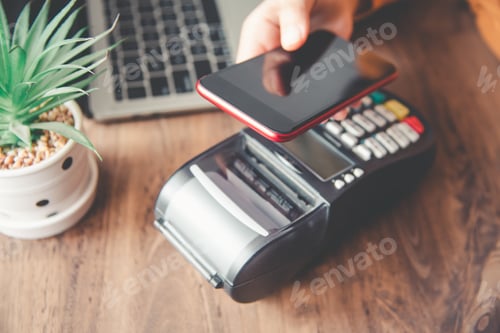 Preview: Payment with NFC technology by mobile phone. Modern cashless payments.