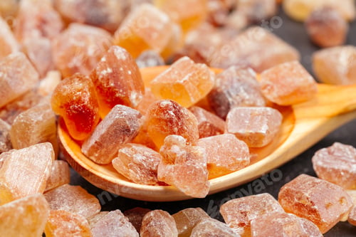 Preview: brown sugar rock organic crystalline close up on dark background