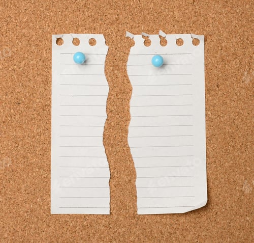 Preview: Torn sheet of white paper in a line hanging on a brown cork board