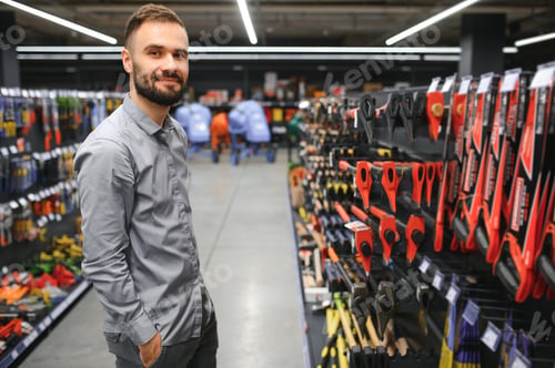 Preview: male builder in a hardware store