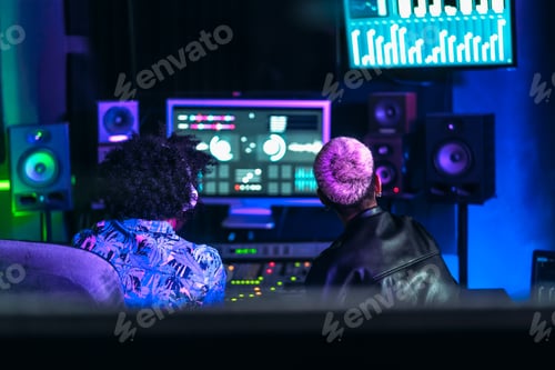 Preview: Young audio engineer people working with mixer sound panel control in music recording studio